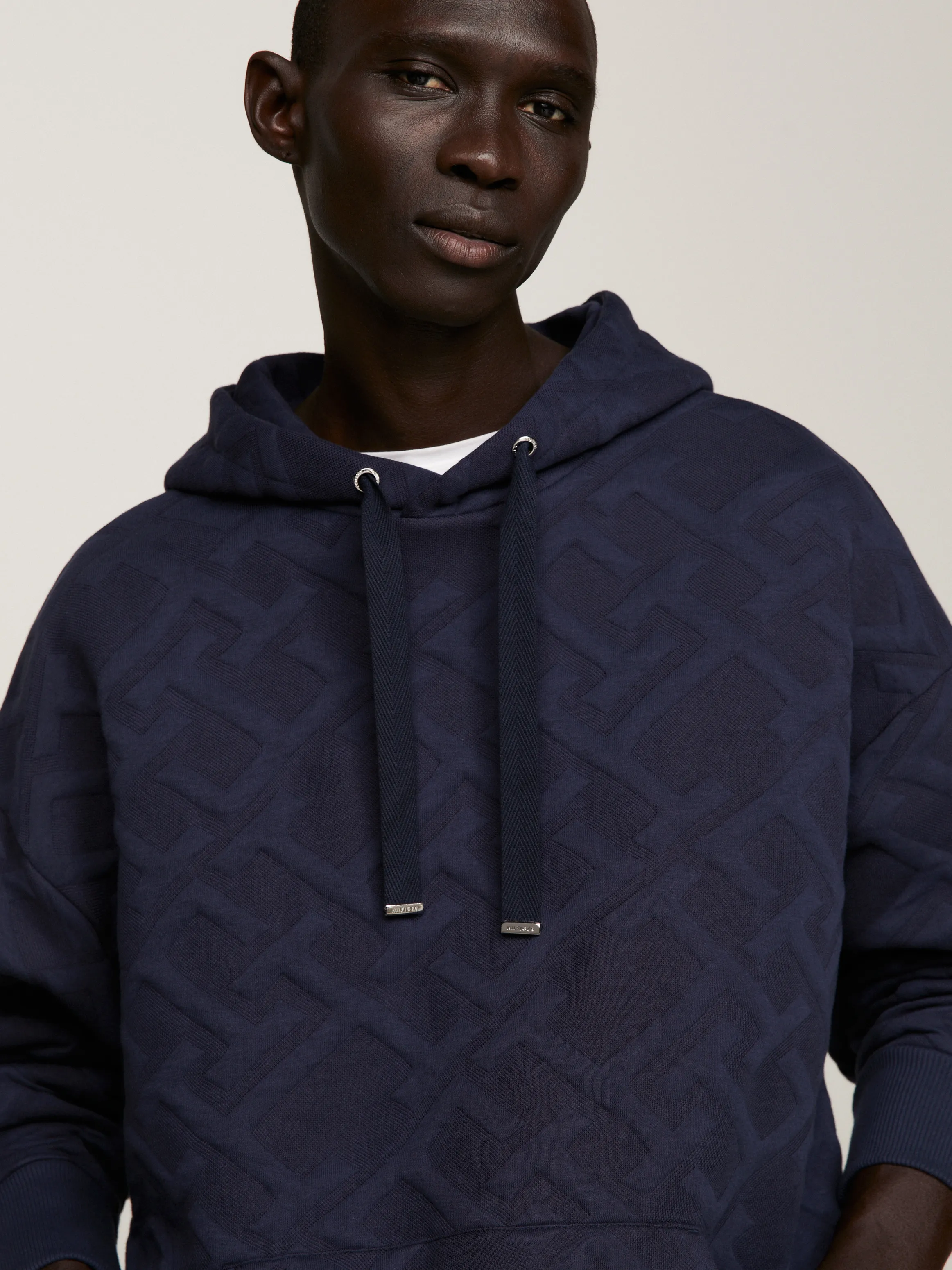 Oversized TH Monogram Embossed Hoody | Sweatshirts & Hoodies | Tommy Hilfiger